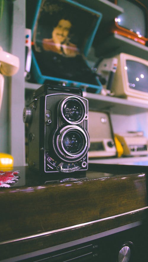 Vintage Twin Lens Reflex Camera on a Wooden Radio