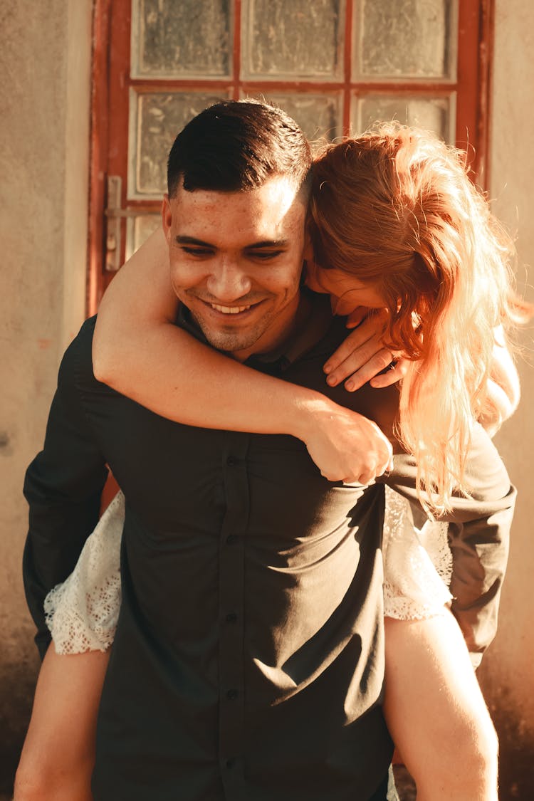 Smiling Man Carrying Woman