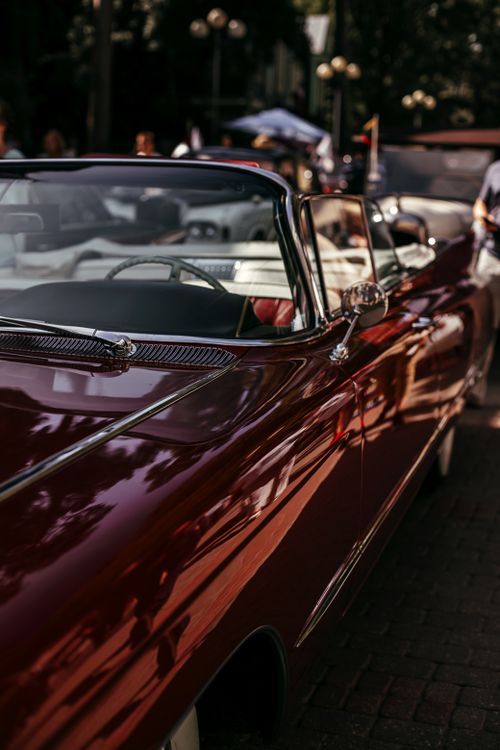 Free Elegant vintage convertible with a glossy finish at an outdoor car show. Stock Photo