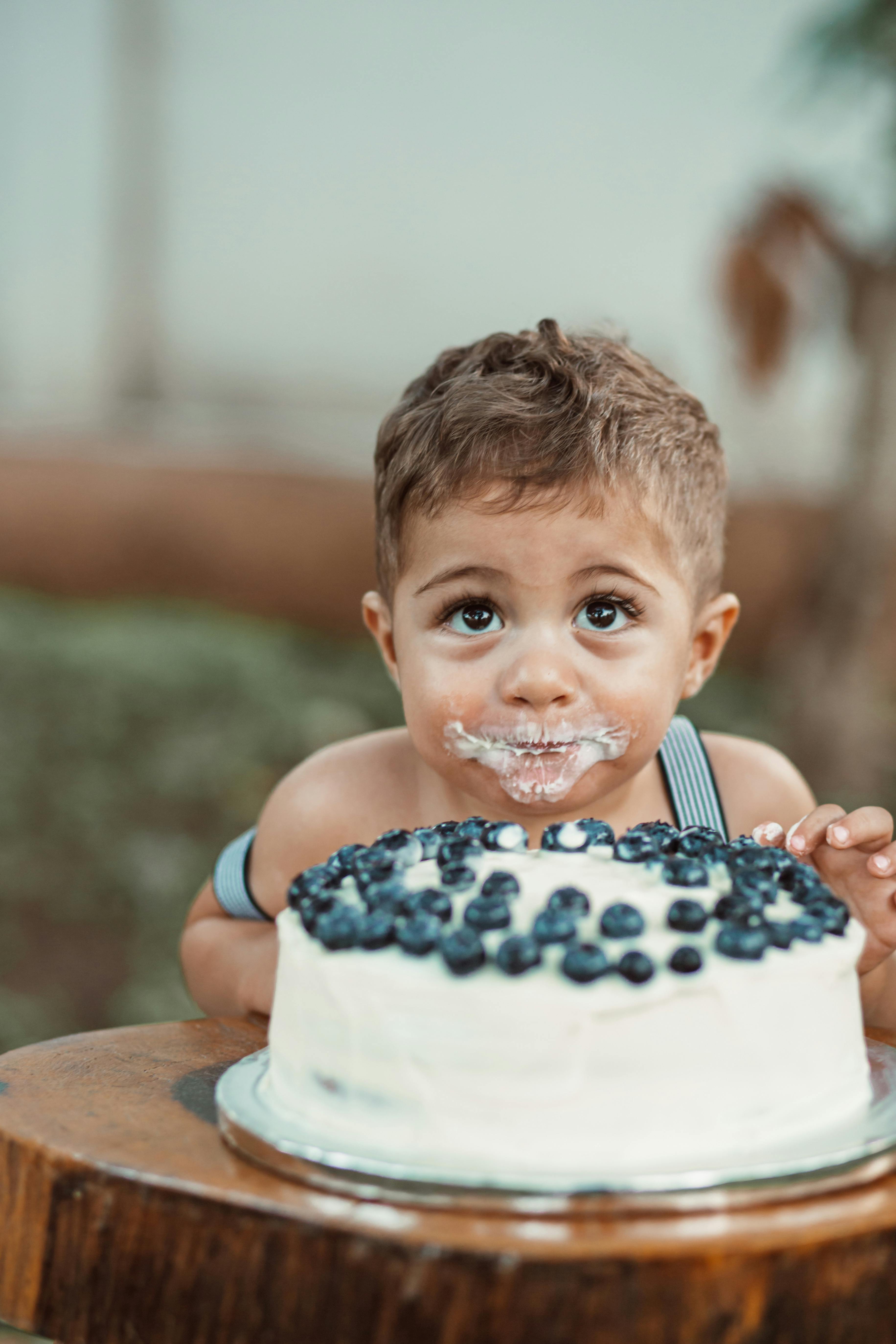 Two boys eating Smarties from birthday cake, Stock Photo, Picture And  Rights Managed Image. Pic. SFD-193356 | agefotostock