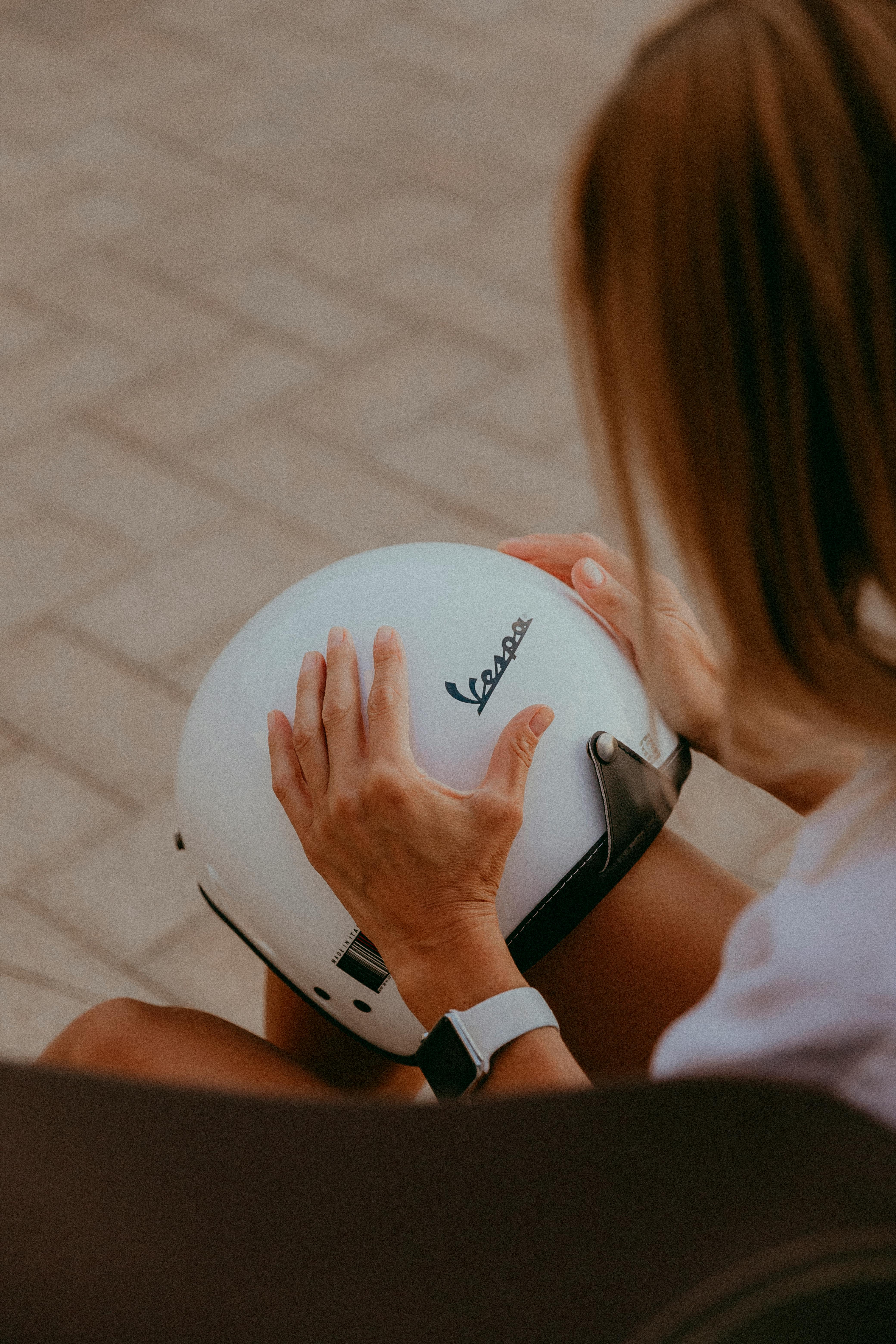 woman hands holding helmet