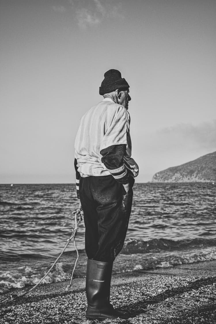 Elderly Fisherman By Sea