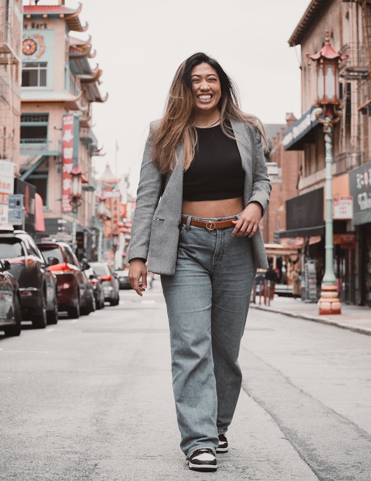 A Woman Walking In A City 