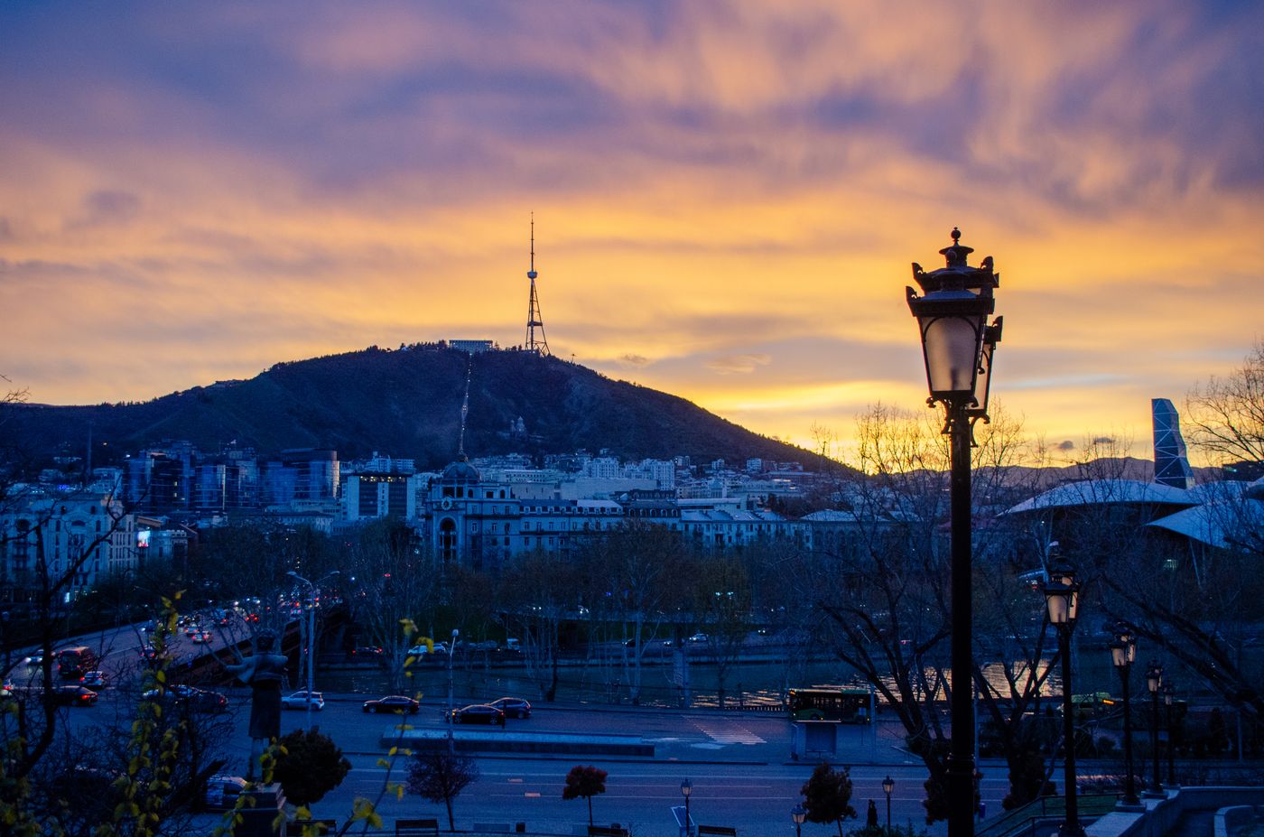 Tbilisi skyline at sunset with Mtatsminda tower in the distance