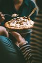 Person Holding Pie And Spoon