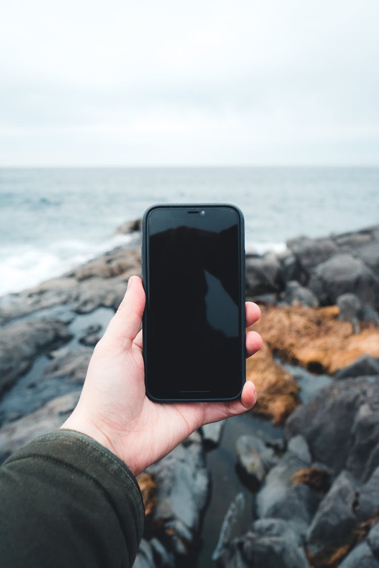 Person Holding Mobile Phone