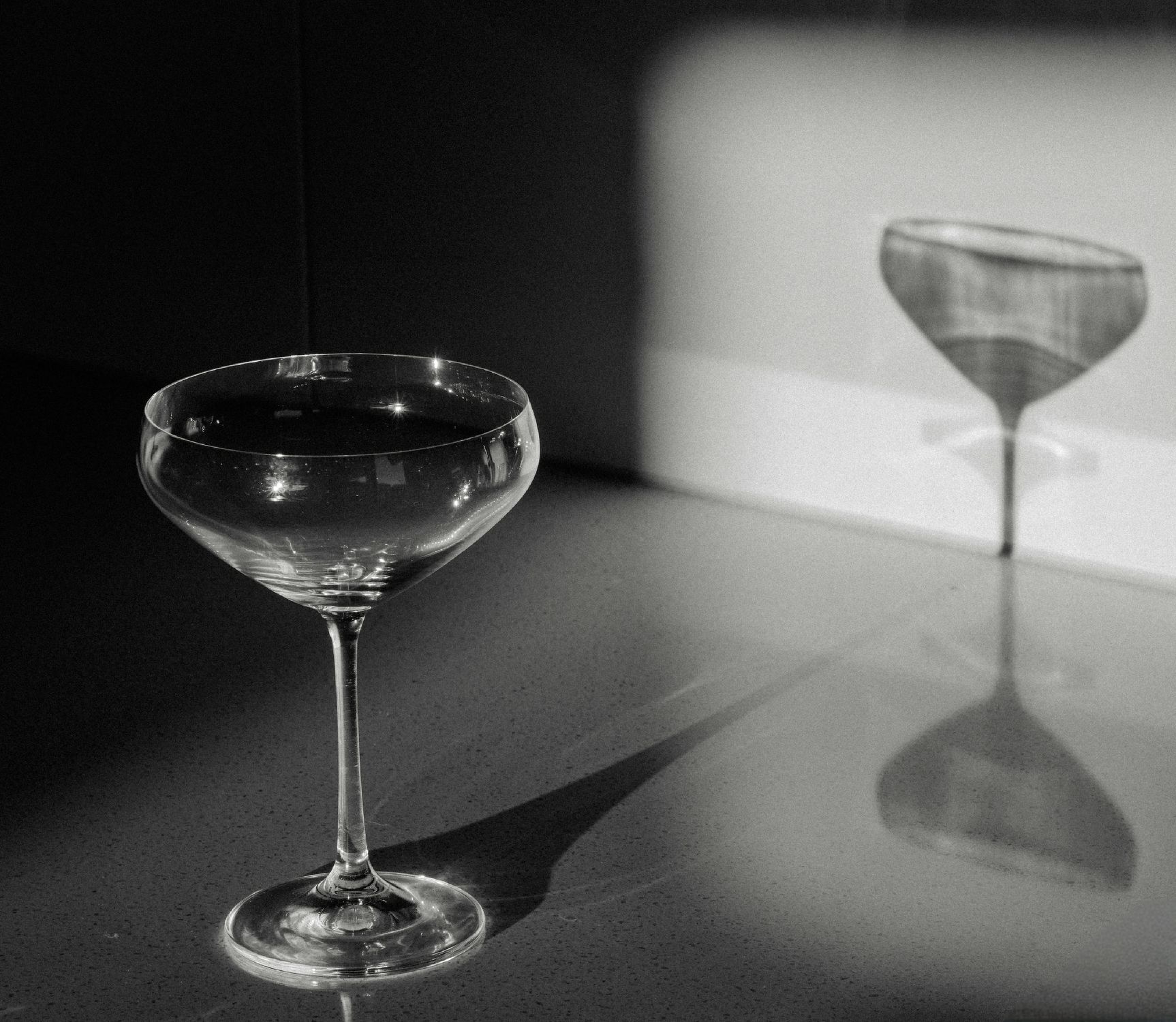 Black and White Photo of Martini Glass Casting Shadow on Wall ยท Free ...