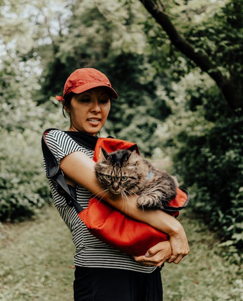Woman Hiking with Gray Cat in Bag