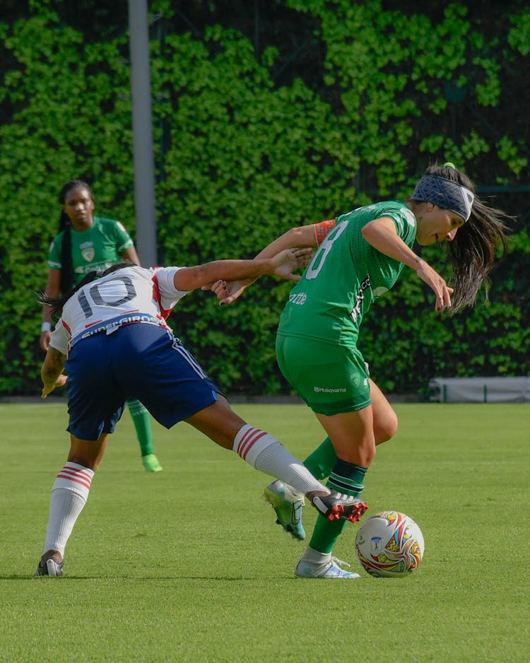 Women Playing Football Match