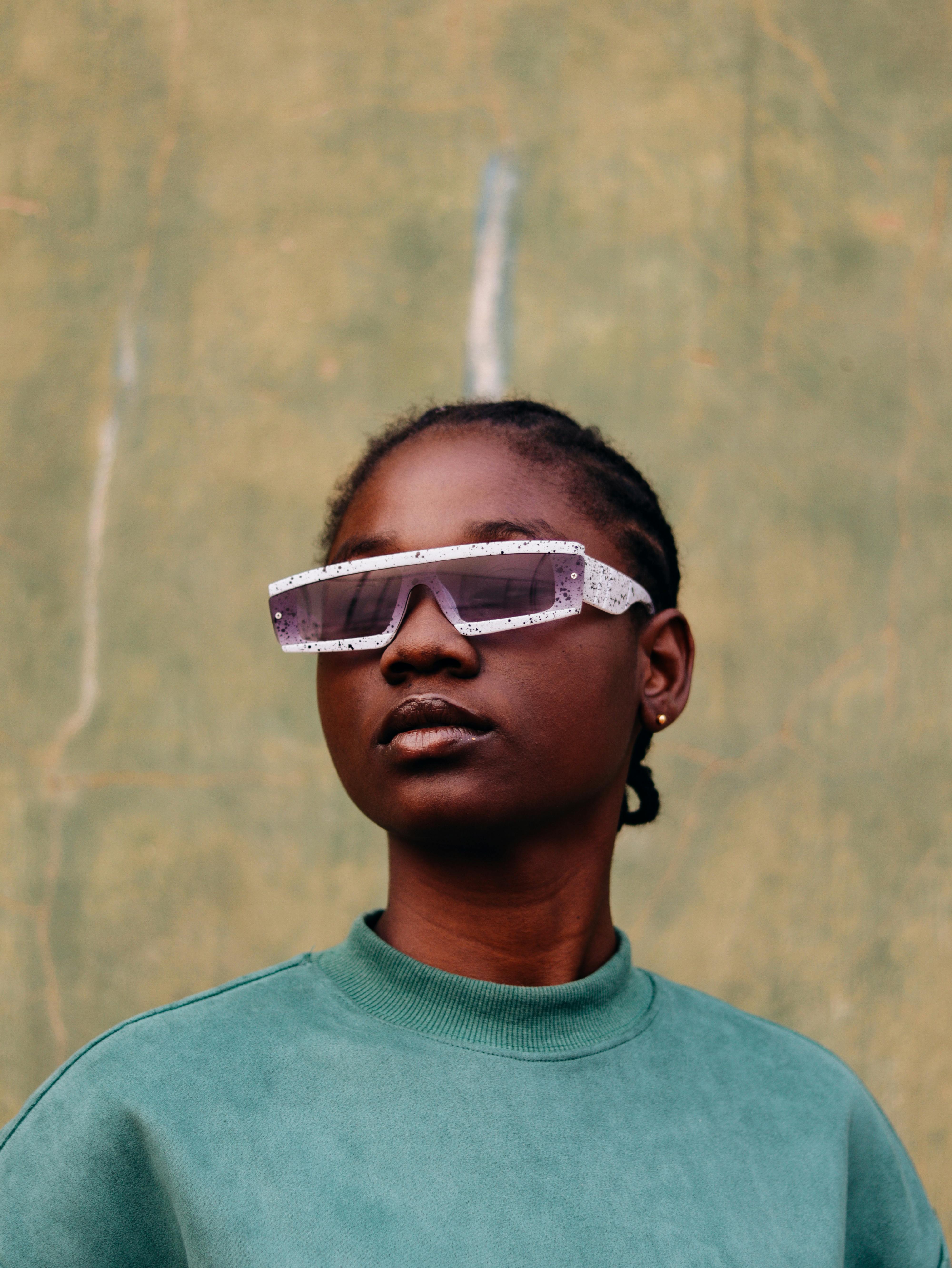 Girl in Sport Sunglasses Posing Outdoors · Free Stock Photo