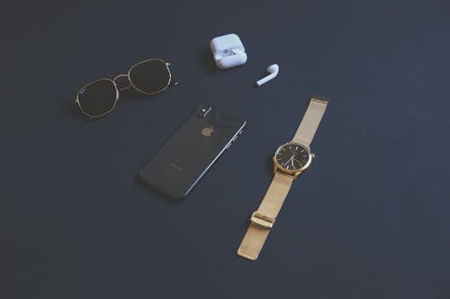 Free Photo of Iphone Near Sunglasses And Watch Stock Photo