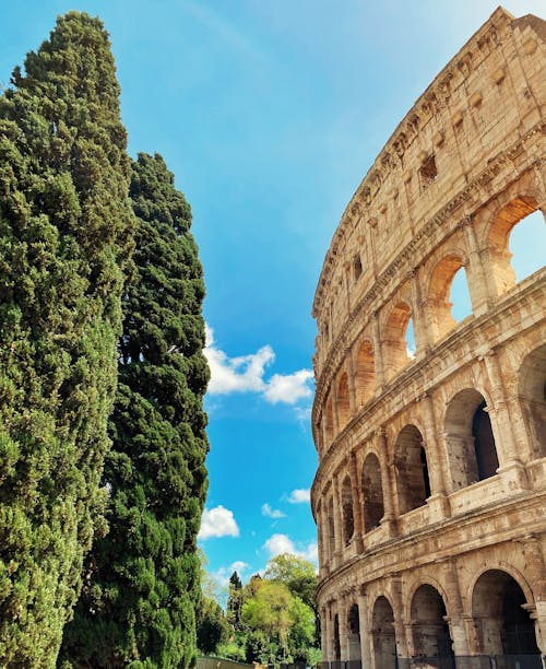 Foto profissional grátis de anfiteatro, céu azul, Coliseu