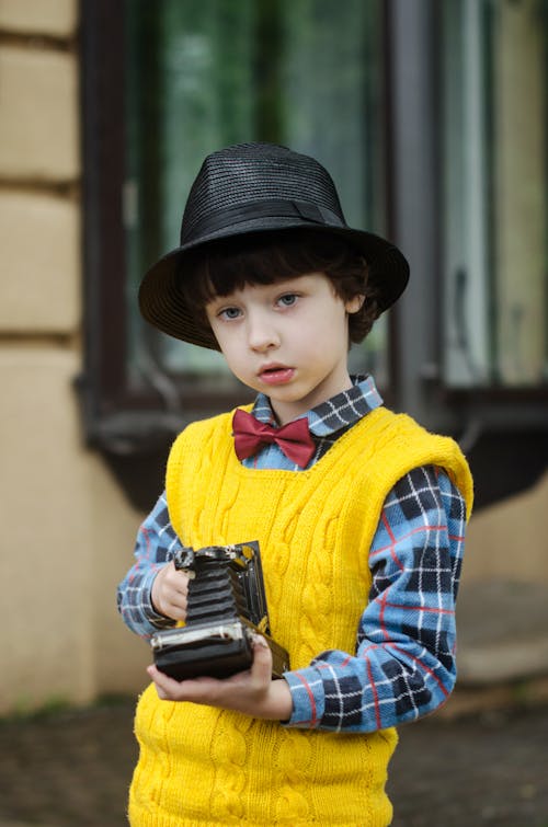 Free Boy Holding Camera Stock Photo