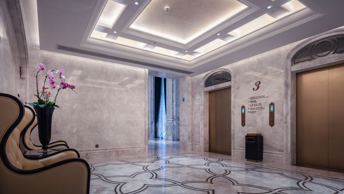 Retail interior with stone floors and elevator lobby