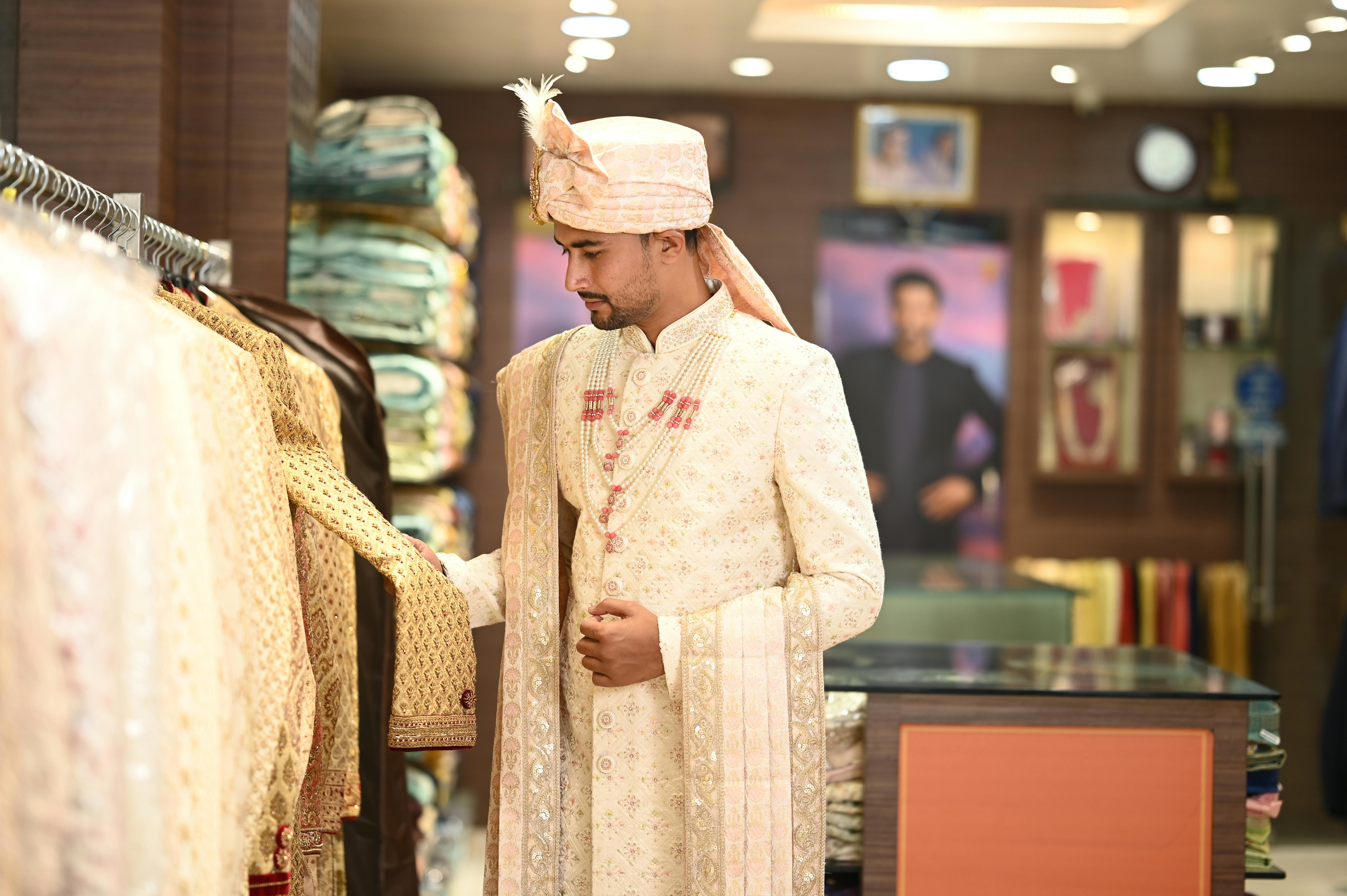 man wearing traditional arabic costume in a shop