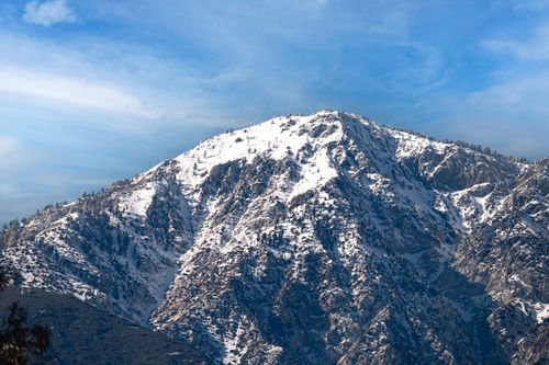 Free Majestic view of the snowcapped San Gabriel Mountains under a clear blue sky in winter. Stock Photo