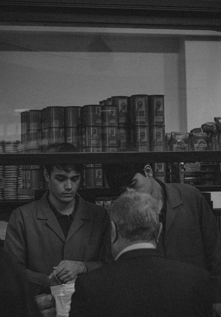 People Standing By Store Window