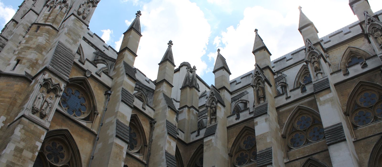 Stunning view of Gothic spires and intricate stonework at Westminster Abbey.