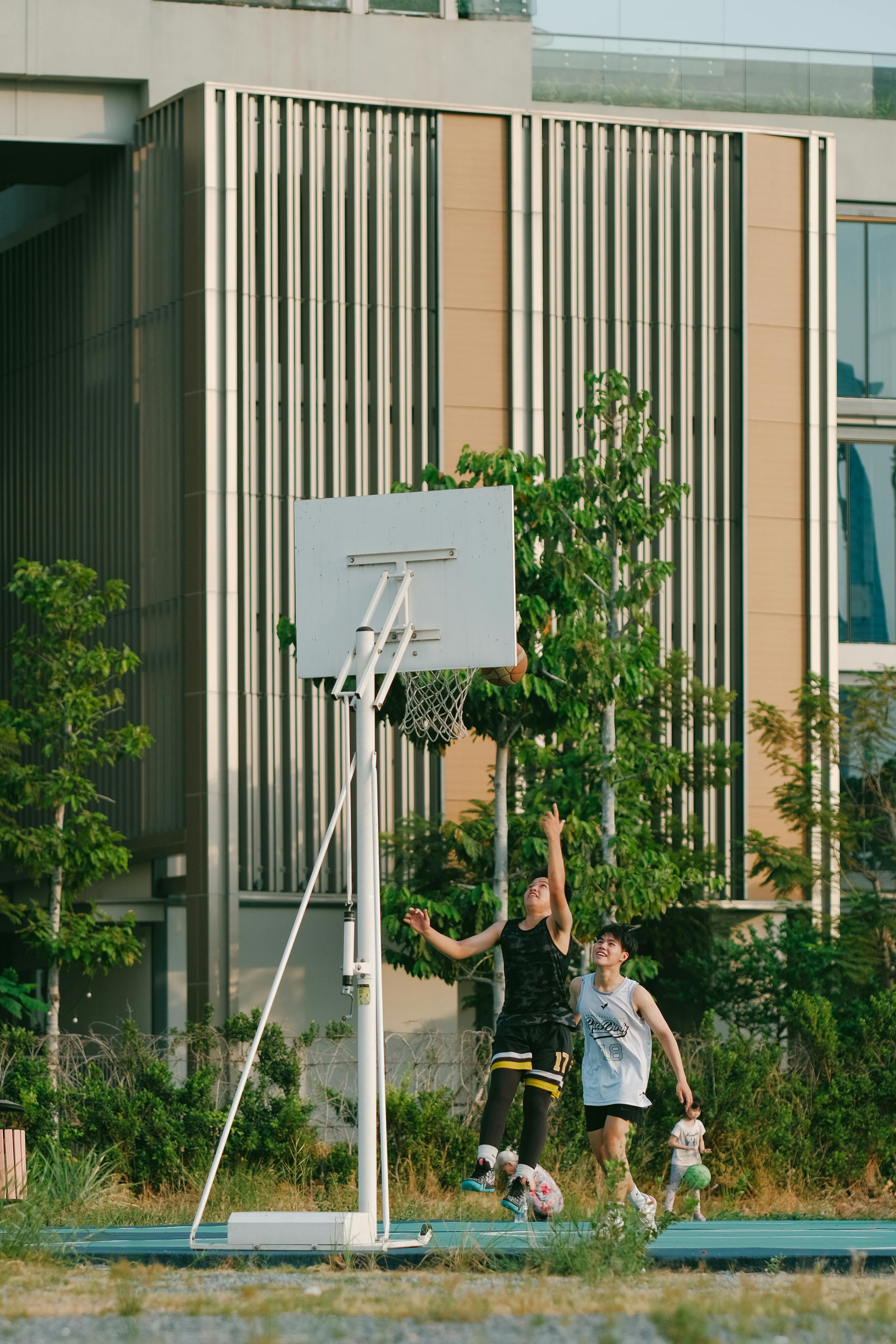 Men Playing Basketball near Building · Free Stock Photo