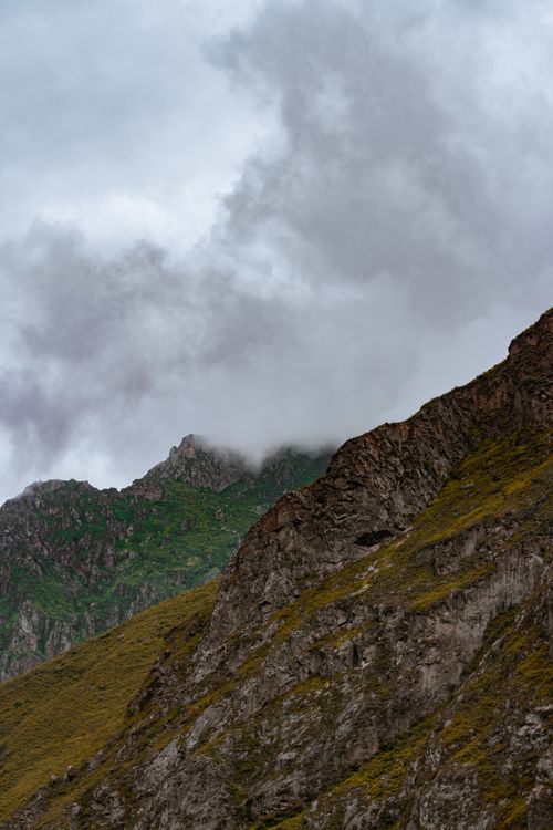 Free Discover the captivating misty peaks and lush greenery of Huaral, Peru. Stock Photo