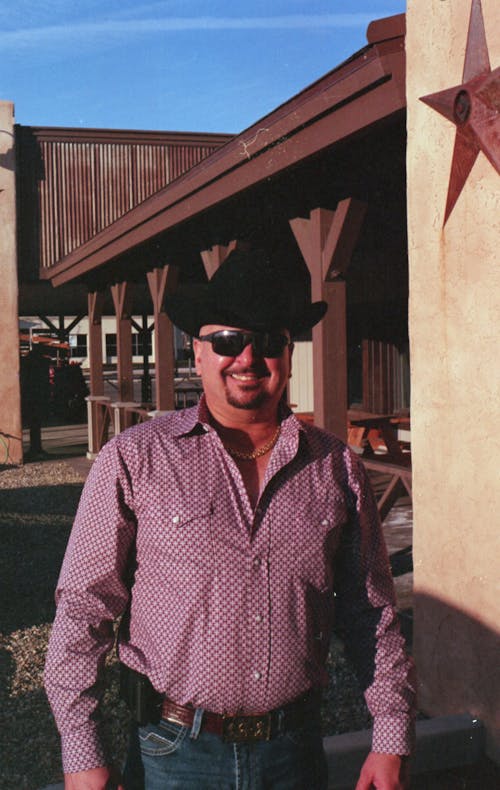 Smiling Man in Shirt, Hat and Sunglasses