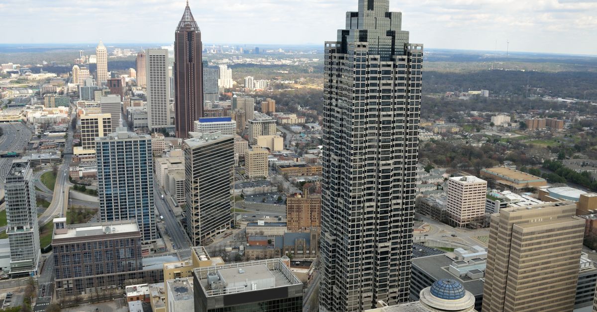 Aerial view of the Atlanta skyline showcasing iconic skyscrapers amidst a vibrant cityscape.
