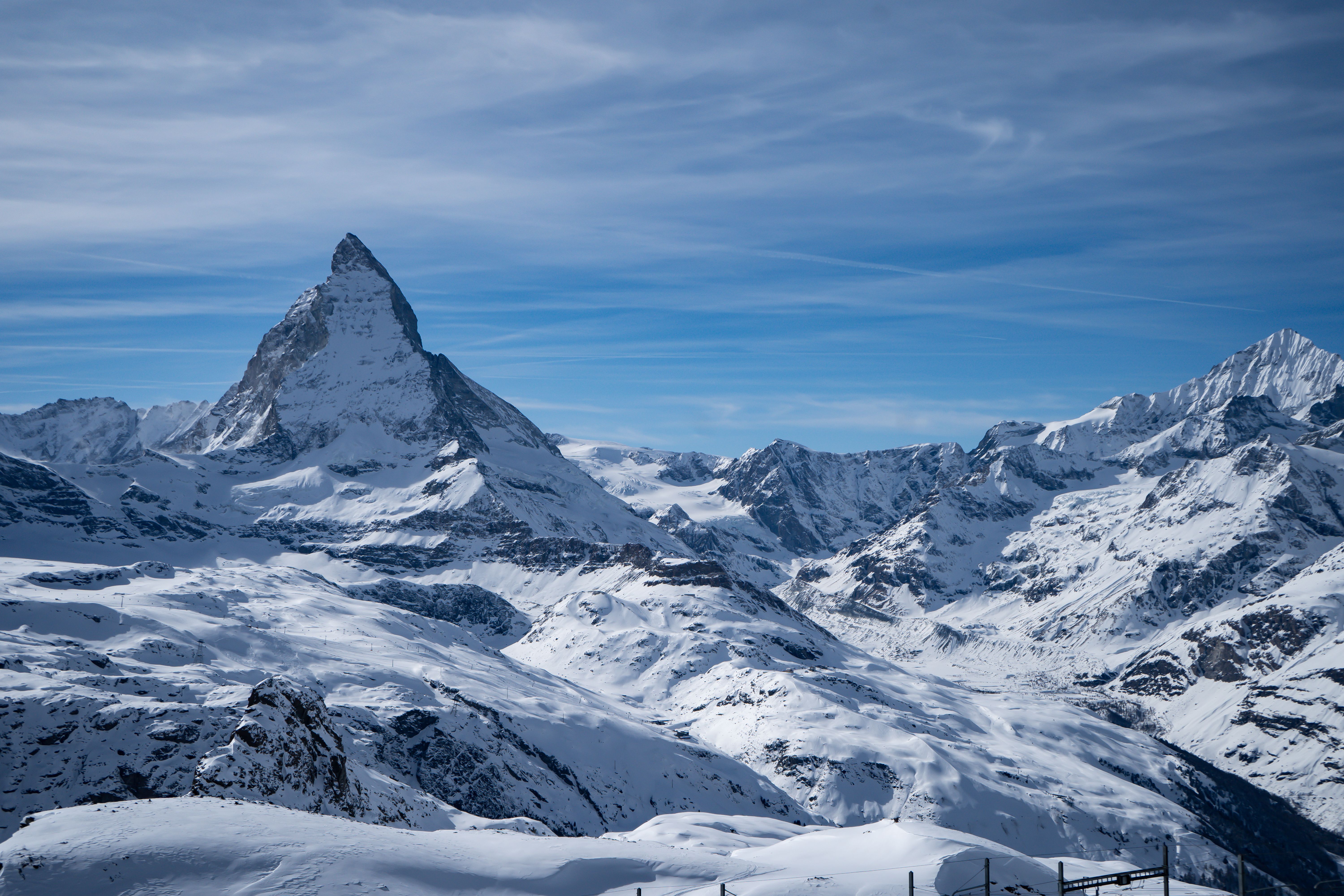 Stunning view of the snow-covered Matterhorn mountain in Zermatt, Switzerland, under a clear blue sky.