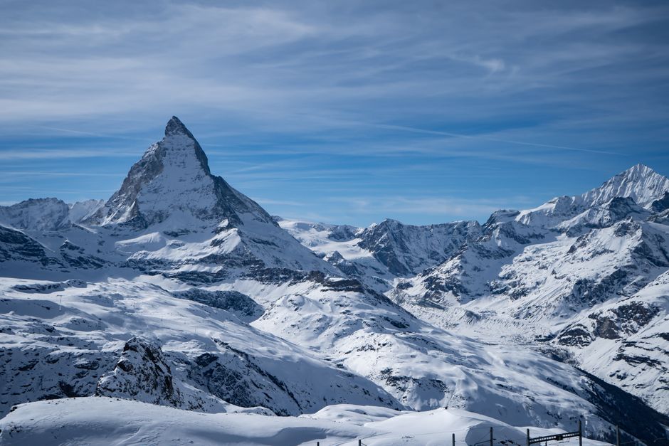 Stunning view of the snow-covered Matterhorn mountain in Zermatt, Switzerland, under a clear blue sky.