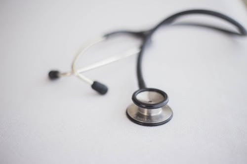 Close-up of a Stethoscope Lying on a White Surface