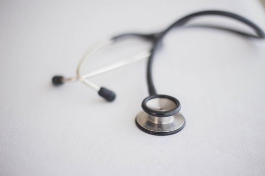A detailed close-up photo of a stethoscope on a clean white background, ideal for health topics.