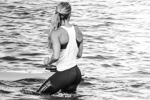 Woman Standing In Body Of Water