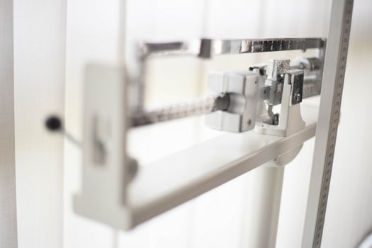 Detailed view of a classic mechanical balance scale, offering precision in weight measurement.