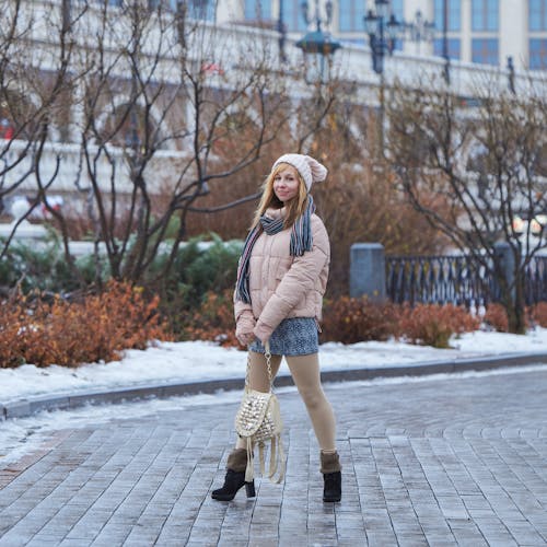 Woman Posing in Jacket and with Bag in Winter