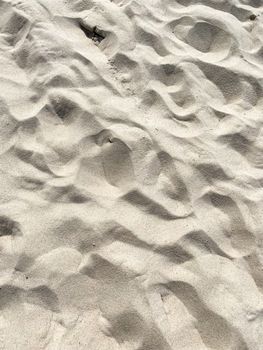 Textured close-up of ripples and patterns on a sandy beach in Sylt, Germany.