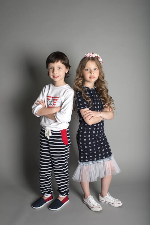 Free Two Children Standing While Crossing Their Arms Stock Photo