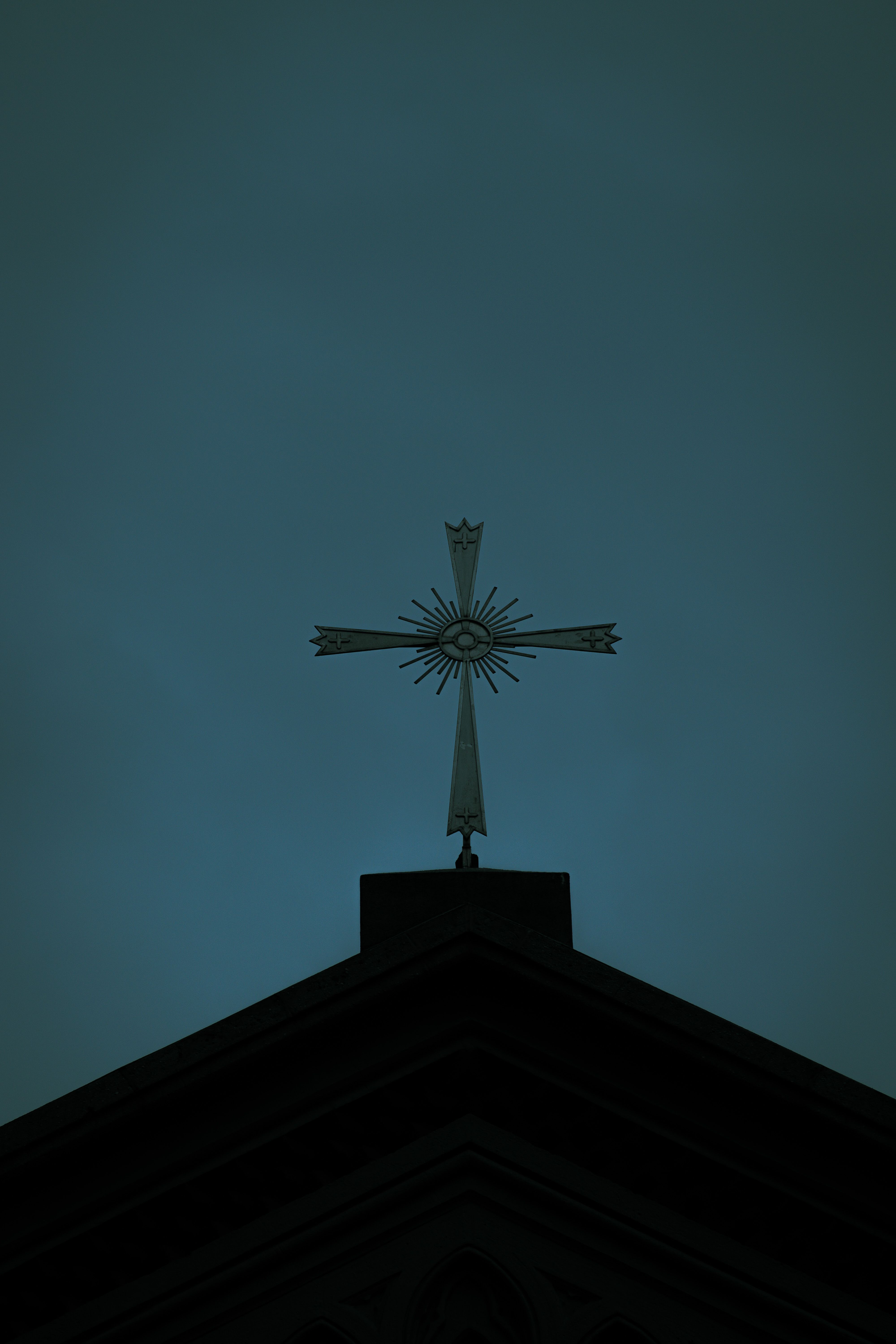 Low Angle Shot of a Cross on a Church Roof on the Background of a Clear ...