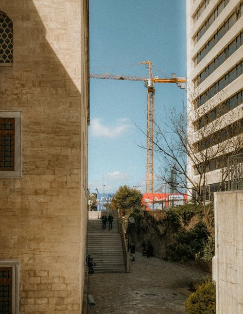 Construction Crane behind Buildings