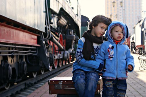 Two Boy Beside Train 