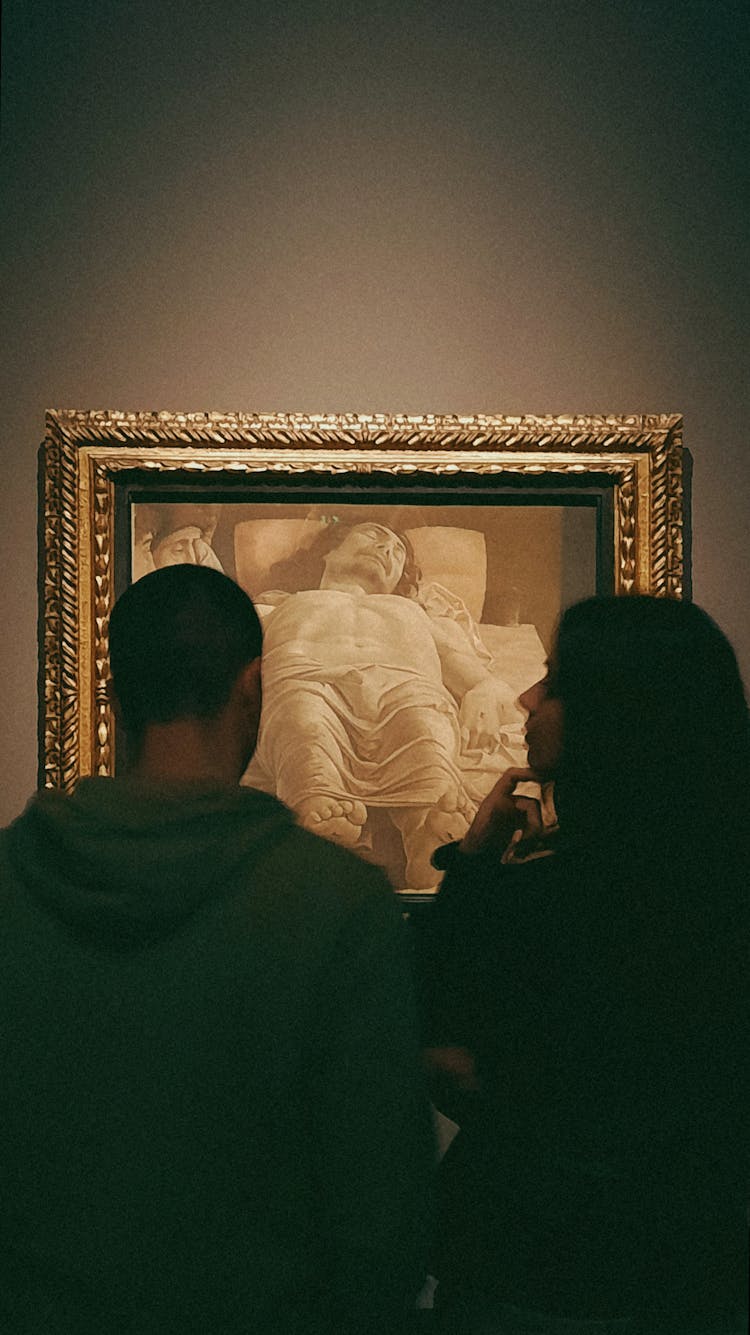 Couple Admiring Renaissance Painting Lamentation Of Christ By Andrea Mantegna