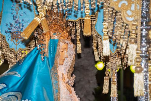 Free Detailed statue of Holy Mary with blue veil and golden crown, showcasing intricate religious craftsmanship. Stock Photo