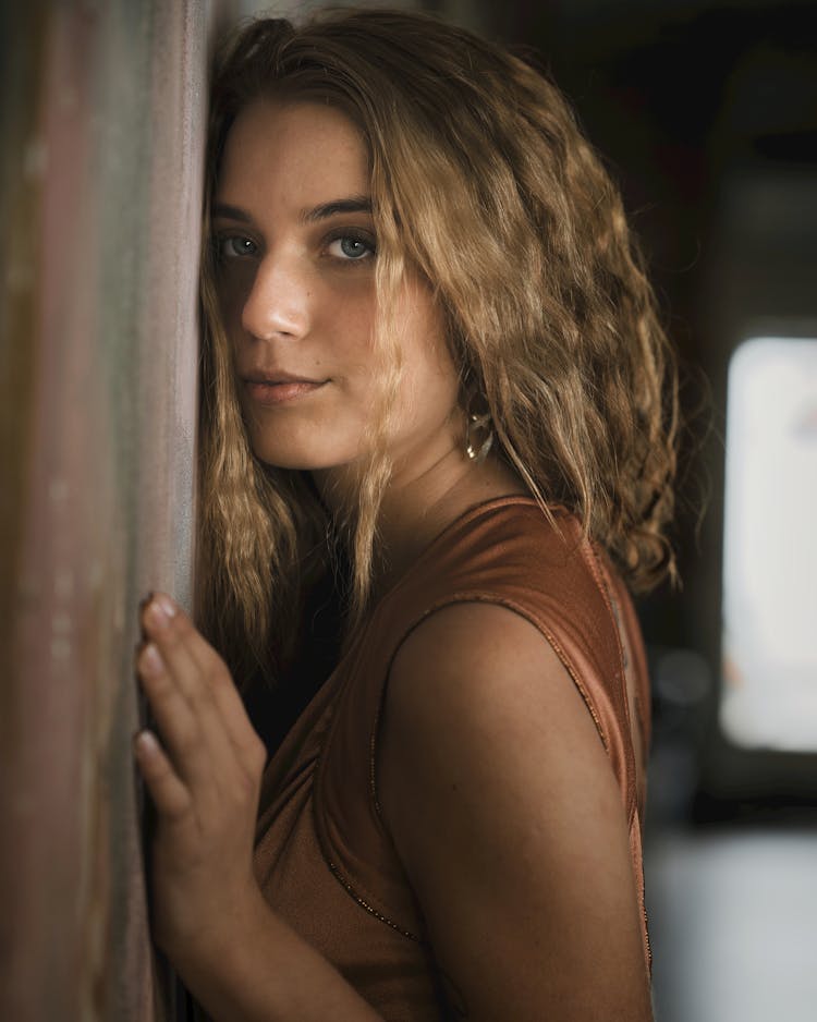 Beautiful Woman Posing Near Wall