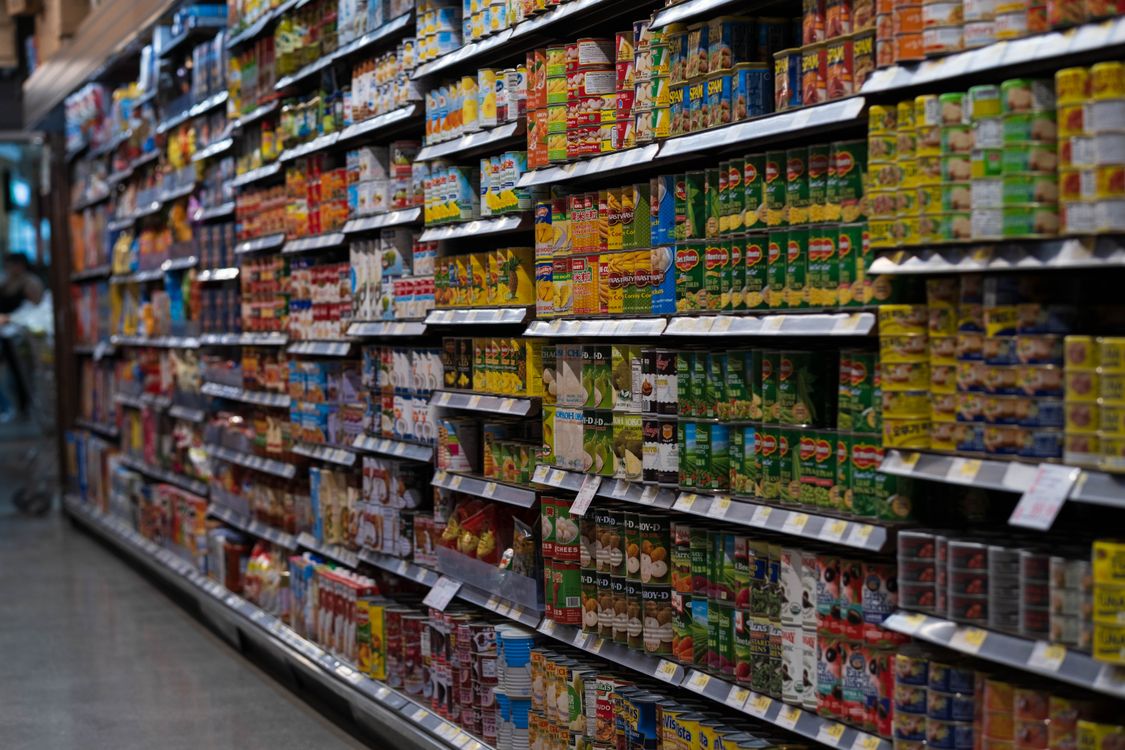 Stocked shelves in a supermarket aisle