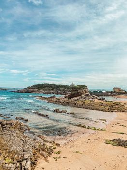 Discover the rugged coastline and serene beaches of Santander in this stunning ocean view.