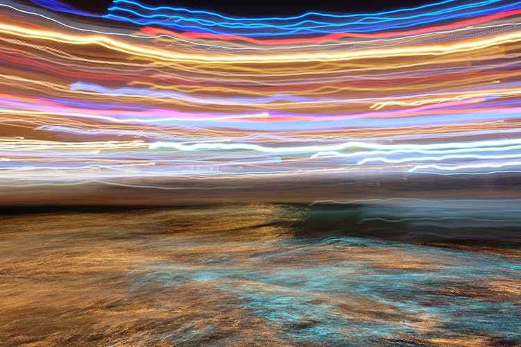 Abstract Photo Of Water Surface And Colorful Lines In Long Exposure 