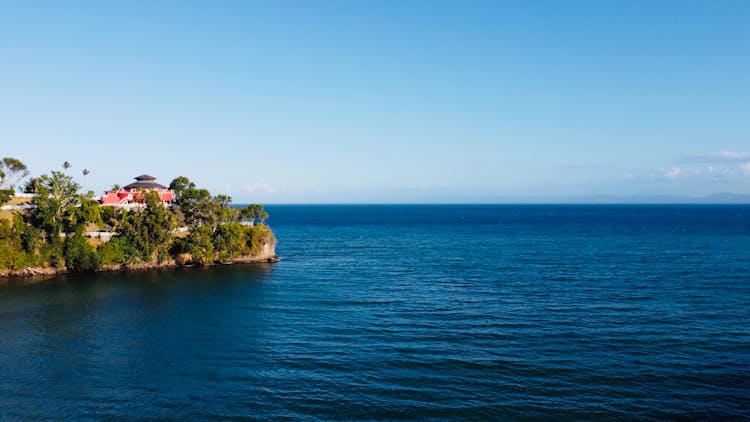 House On A Peninsula Surrounded By The Sea