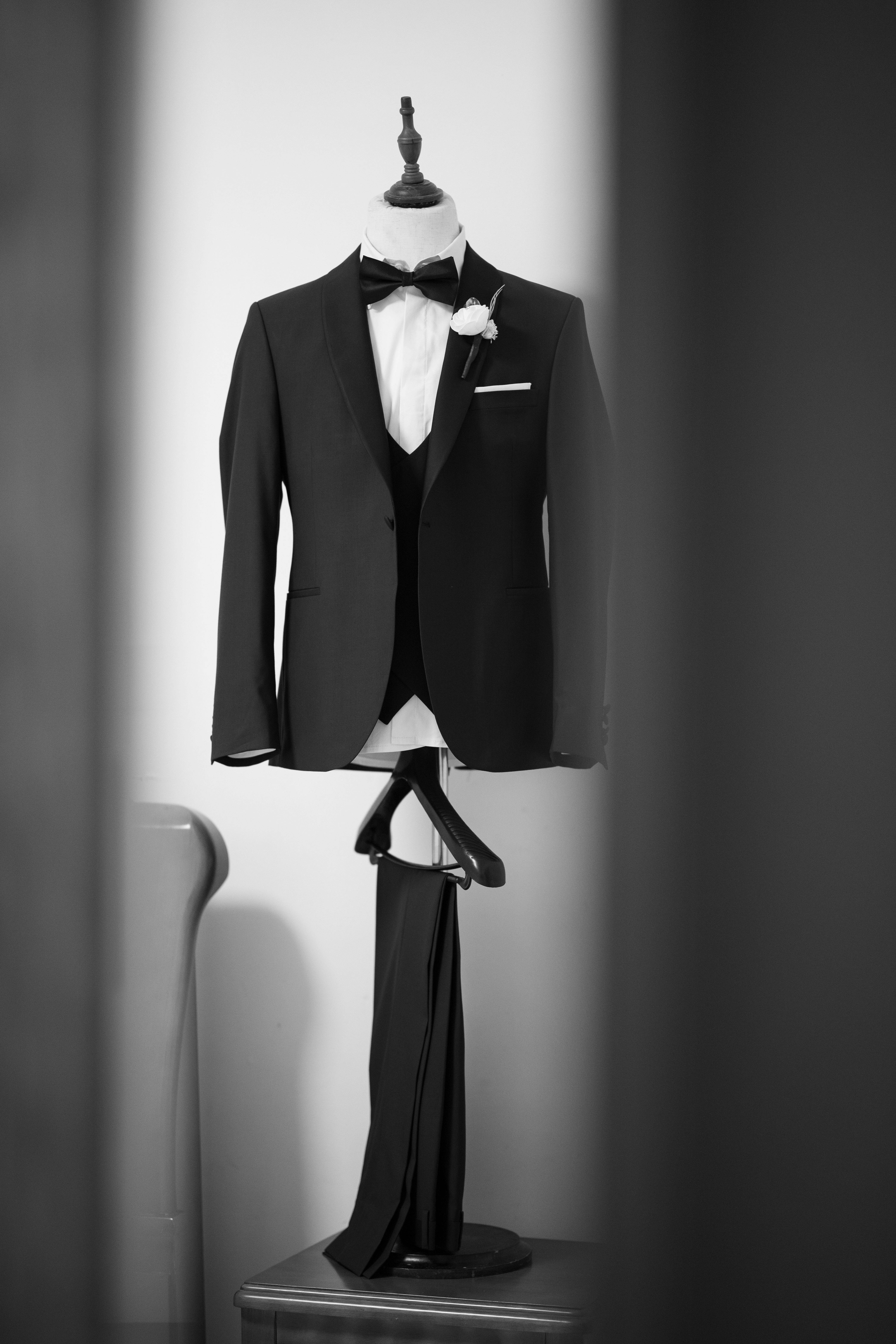 Free Stylish black suit on mannequin captured in artistic black and white photograph. Stock Photo