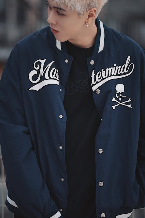 Blonde Man Posing in Navy Blue Baseball Jacket