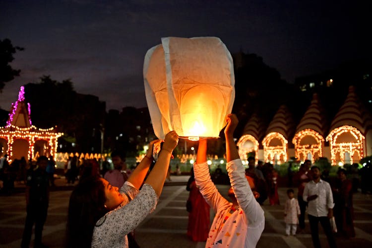 Couple Releasing Flaming Paper Lantern