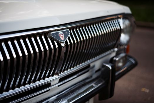 Close-up of a vintage Gaz-24 car grille, showcasing its classic design and details.