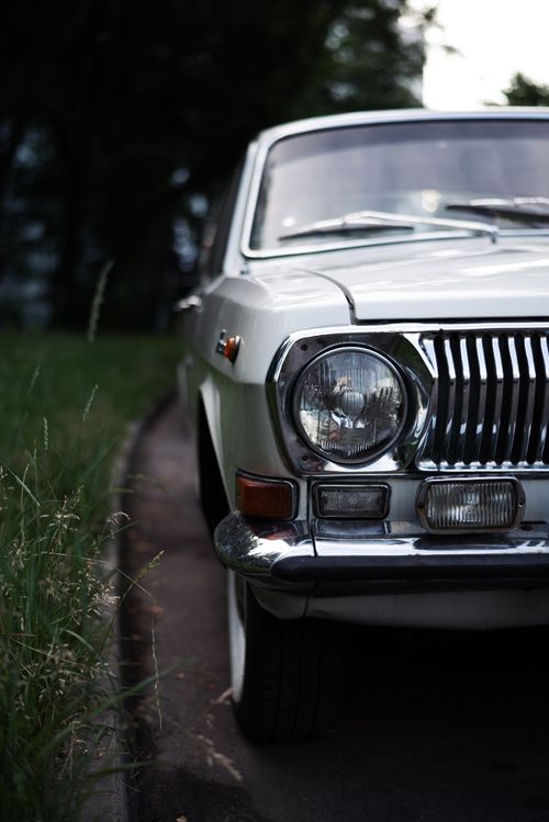 Free Front view of a classic Gaz-24 vehicle in silver, reflecting Soviet-era design. Stock Photo